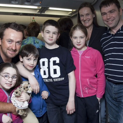 Graeme greets a family as they arrive in Orlando, March 2013.