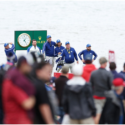 KOHLER, WISCONSIN - SEPTEMBER 21: Shane Lowry of Ireland and team Europe plays his shot from the 18th tee as vice-captain Graeme McDowell of Northern Ireland and team Europe, Ian Finnis, Tommy Fleetwood of England and team Europe, Mick Donaghy, and Tyrrell Hatton of England and team Europe look on during a practice round prior to the 43rd Ryder Cup at Whistling Straits on September 21, 2021 in Kohler, Wisconsin. (Photo by Richard Heathcote/Getty Images)