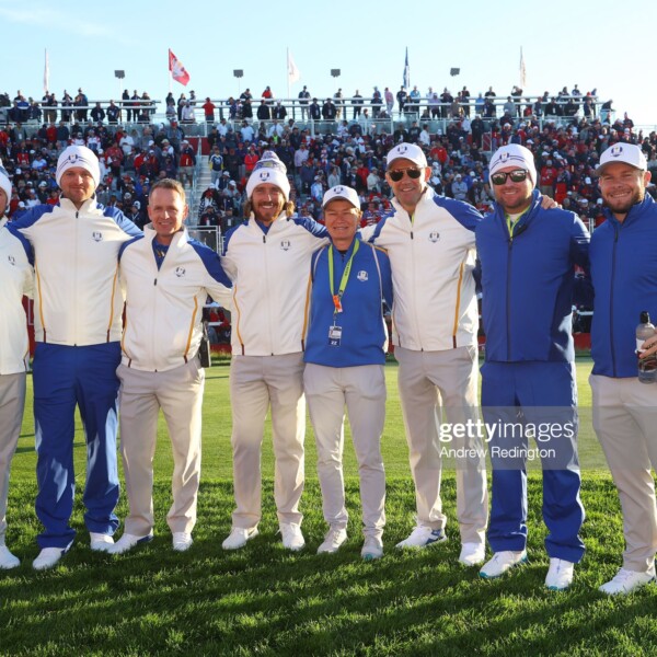 KOHLER, WISCONSIN - SEPTEMBER 24: (L-R) Shane Lowry of Ireland and team Europe, Bernd Wiesberger of Austria and team Europe, vice-captain Luke Donald of England and team Europe, Tommy Fleetwood of England and team Europe, Catriona Matthew, captain Padraig Harrington of Ireland and team Europe, vice-captain Graeme McDowell of Northern Ireland and team Europe, and Tyrrell Hatton of England and team Europe pose for photos on the first tee during Friday Morning Foursome Matches of the 43rd Ryder Cup at Whistling Straits on September 24, 2021 in Kohler, Wisconsin. (Photo by Andrew Redington/Getty Images)